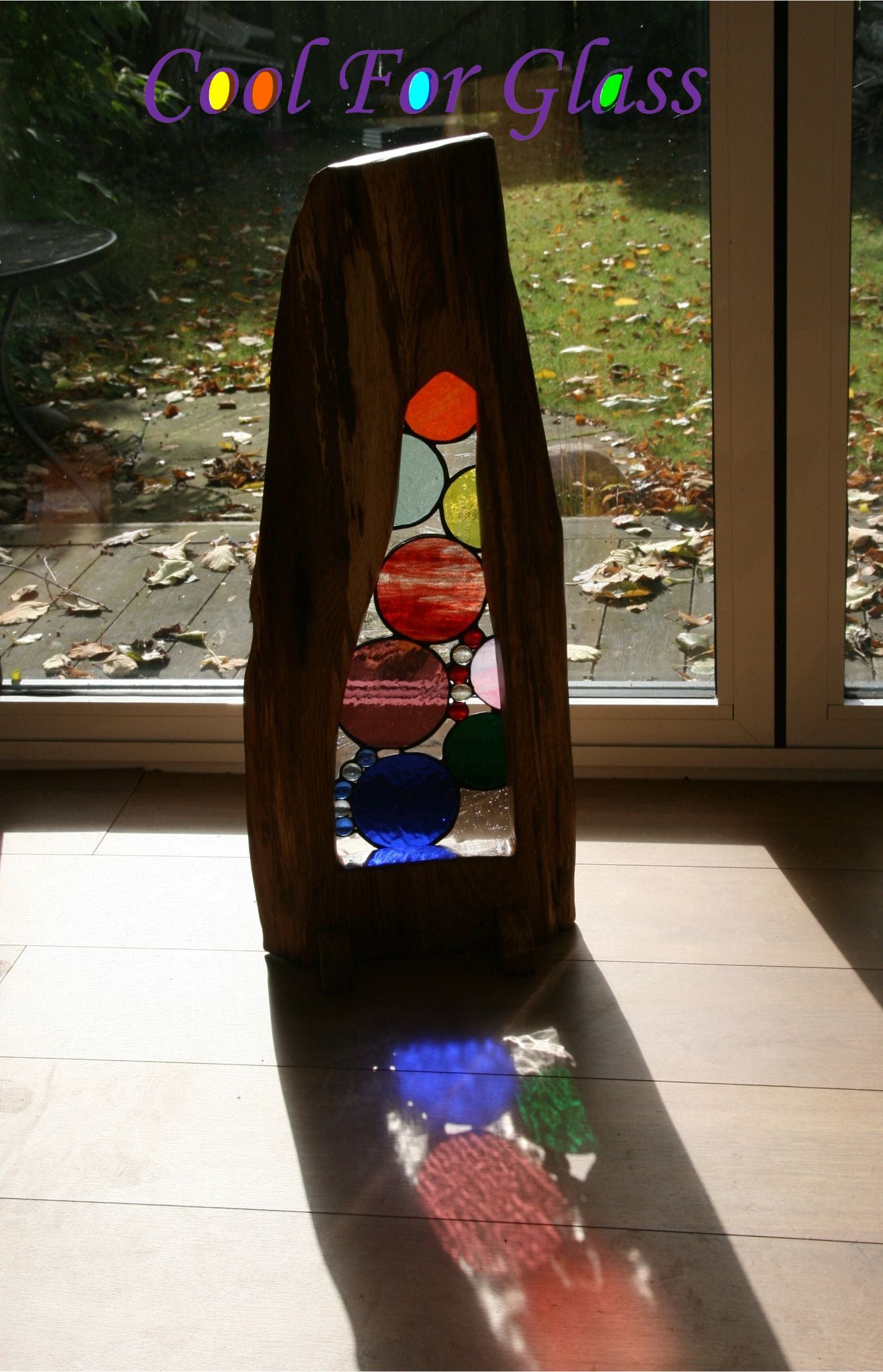 'Circles' stained glass in sustainably sourced brown oak frame.