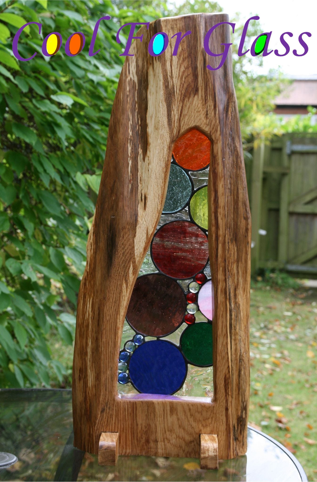 'Circles' stained glass in sustainably sourced brown oak frame.