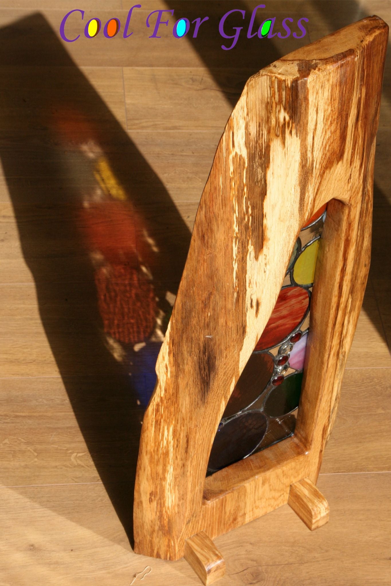 'Circles' stained glass in sustainably sourced brown oak frame.