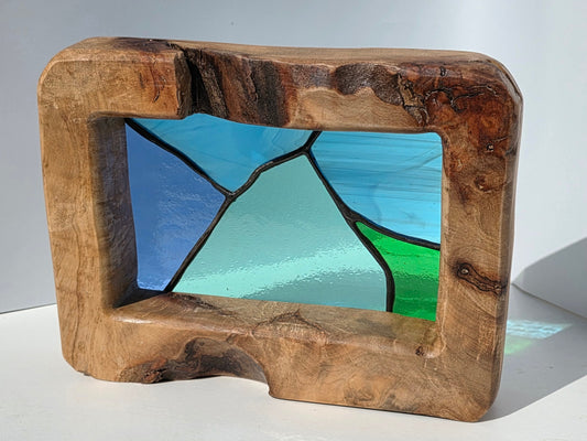Abstract landscape stained glass in a solid oak frame