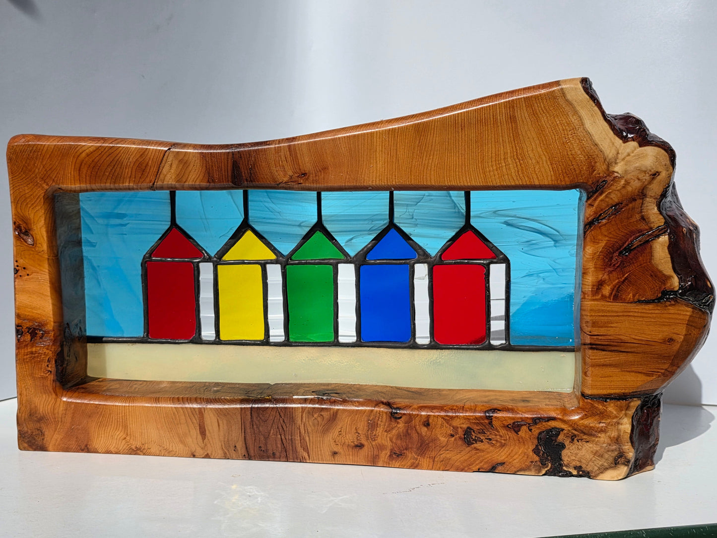 Stained glass Beach huts in solid yew wood frame.