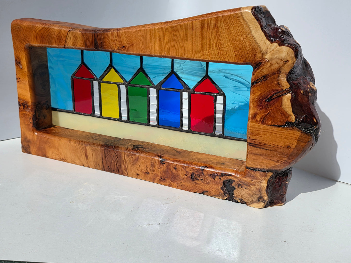 Stained glass Beach huts in solid yew wood frame.
