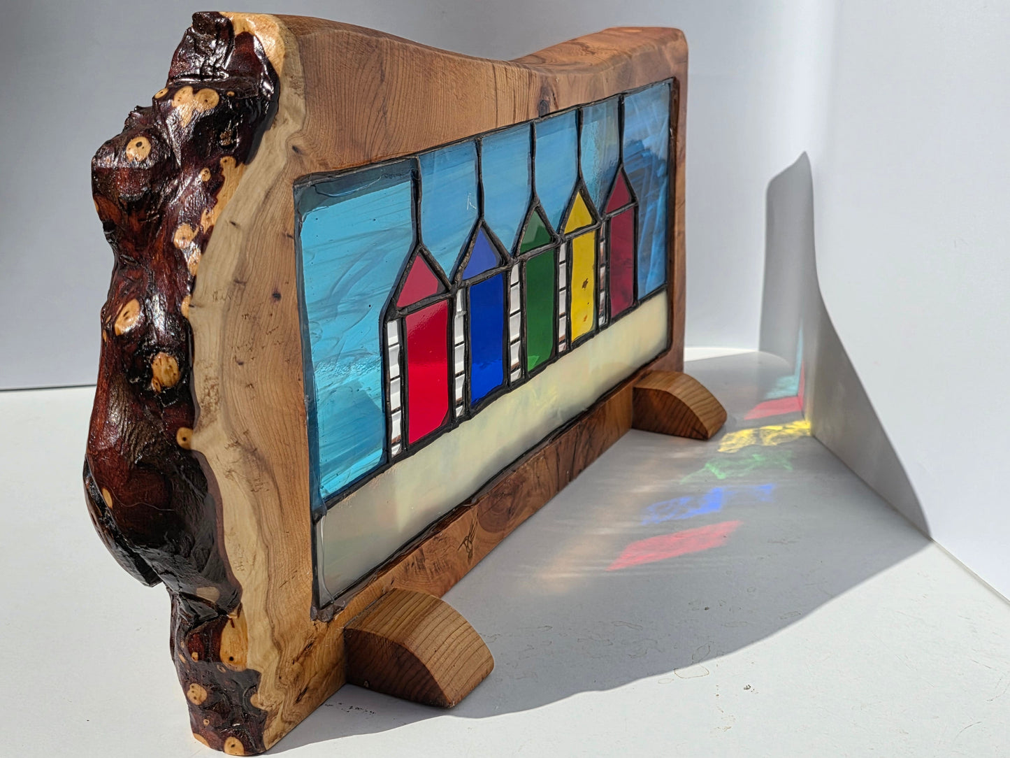 Stained glass Beach huts in solid yew wood frame.