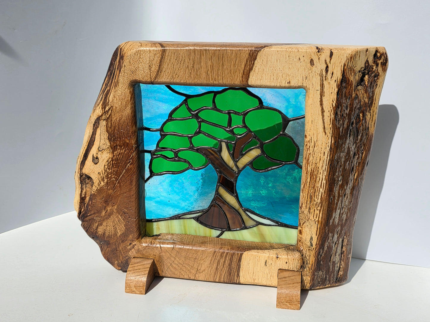 Stained glass 'Old Oak Tree' in a solid oak frame