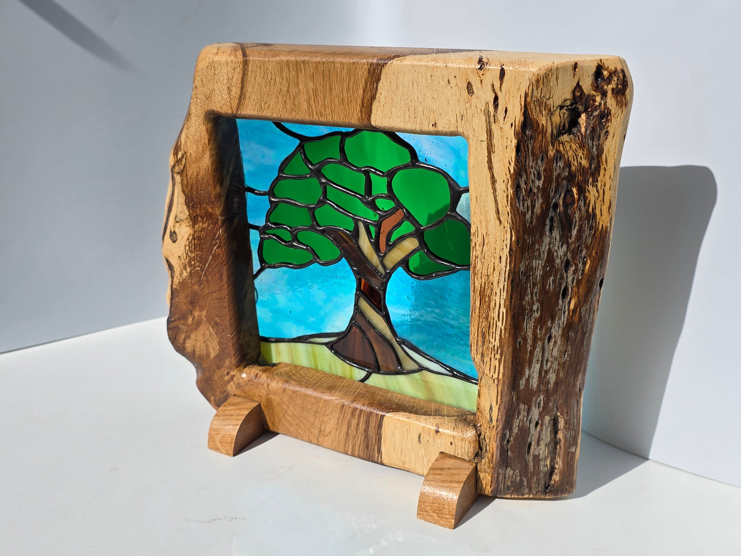 Stained glass 'Old Oak Tree' in a solid oak frame