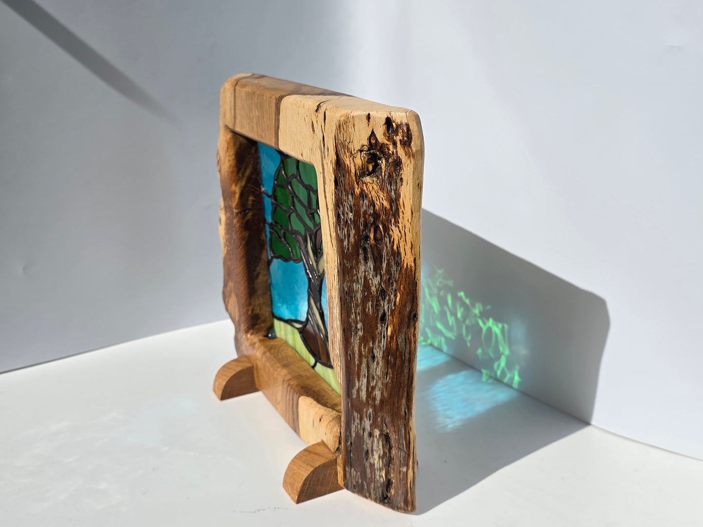 Stained glass 'Old Oak Tree' in a solid oak frame