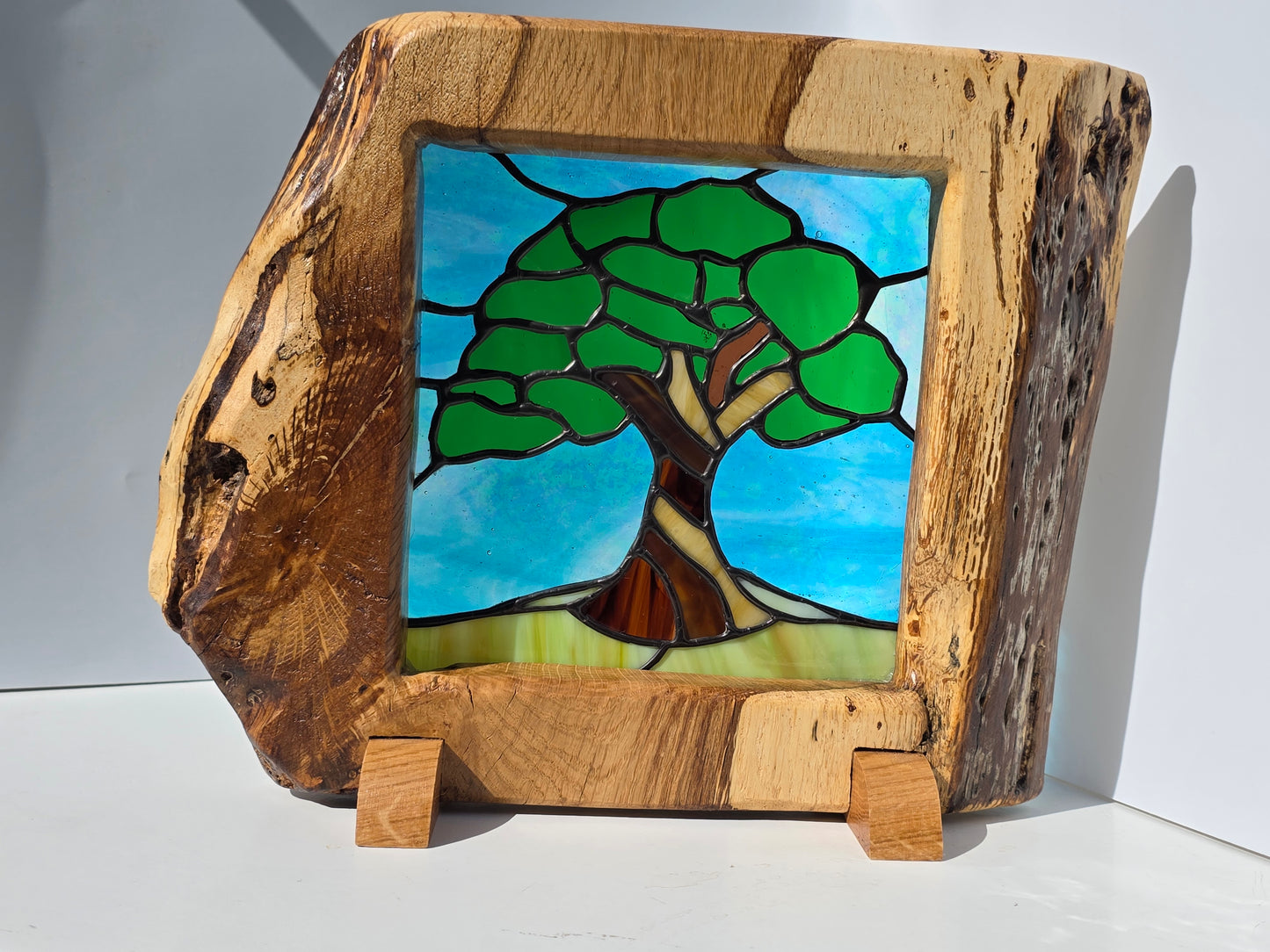 Stained glass 'Old Oak Tree' in a solid oak frame
