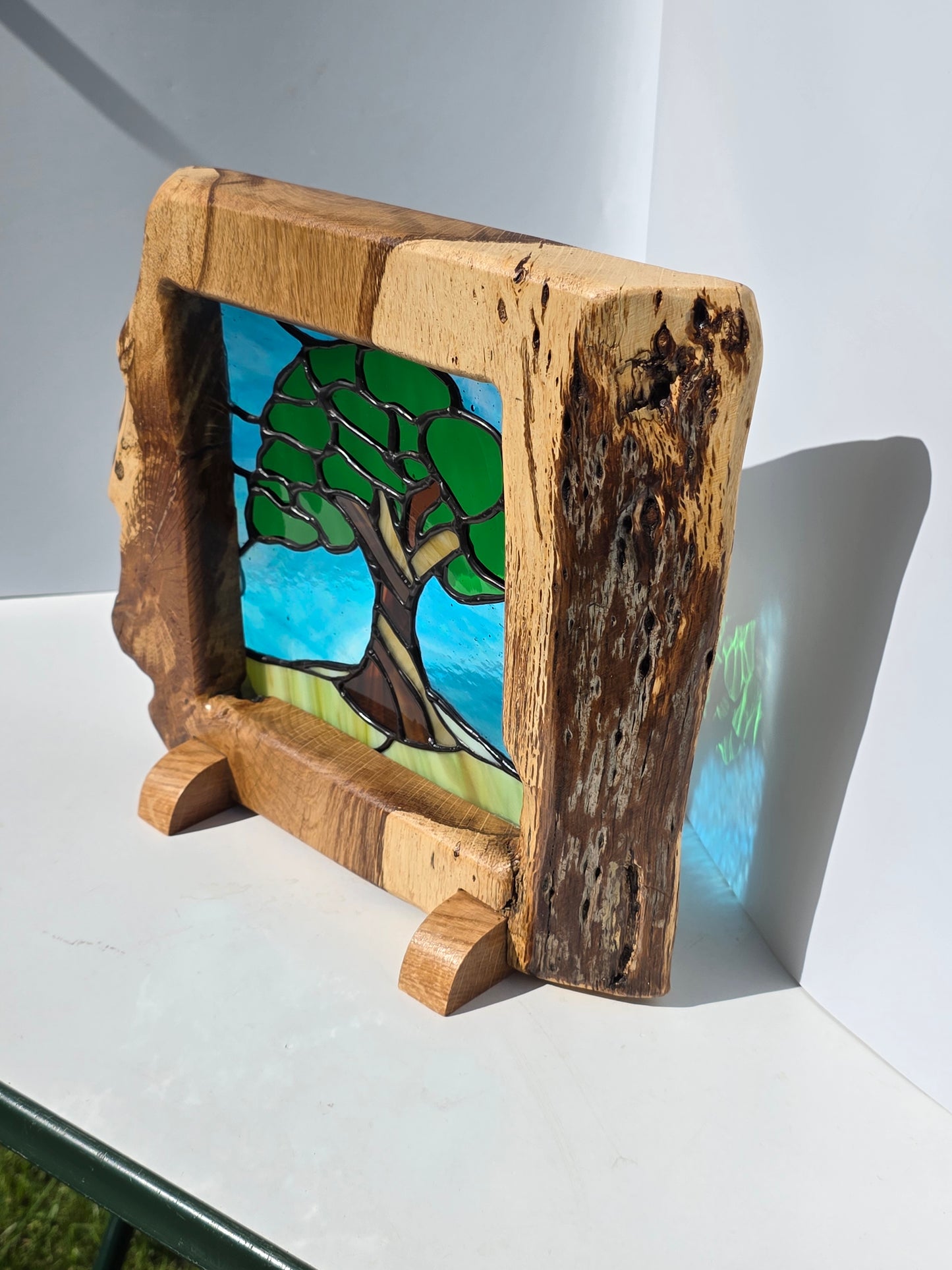 Stained glass 'Old Oak Tree' in a solid oak frame