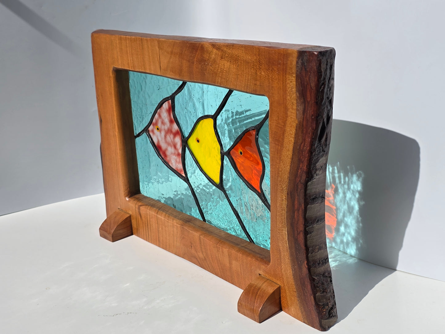 Stained glass 'Trio of Fish' framed in solid wood