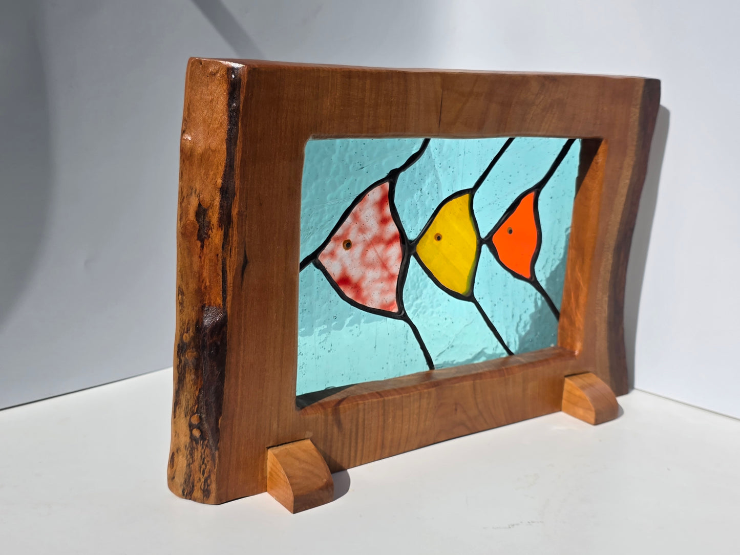 Stained glass 'Trio of Fish' framed in solid wood