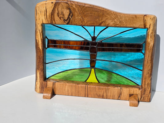 Stained glass 'Angel of the North' in a solid wood frame.