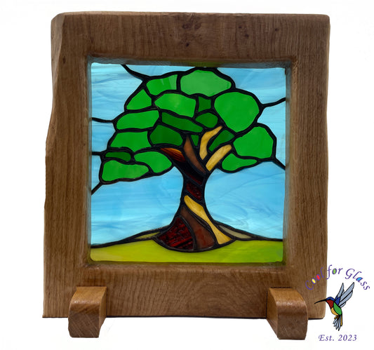 'Old Oak Tree' stained glass panel framed in sustainably sourced oak.